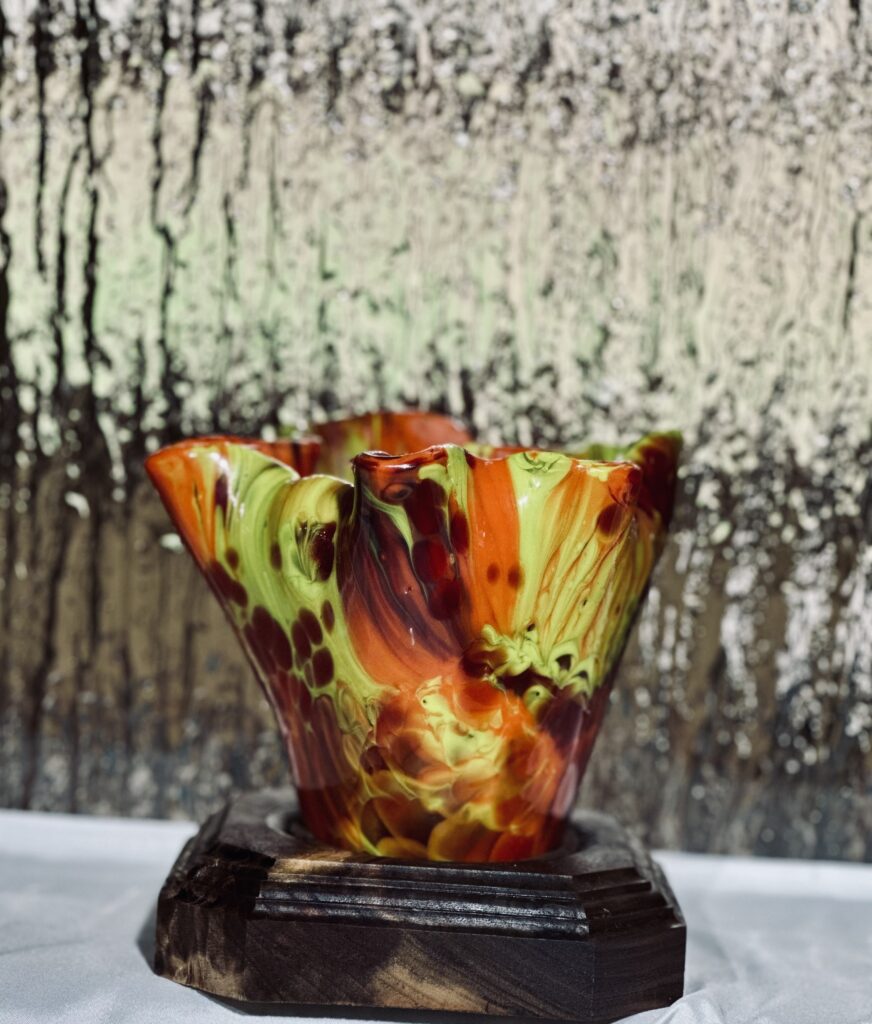 Vase on a walnut wood base